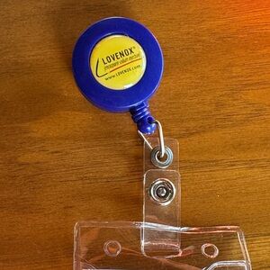 Vintage Lovenox Blue and Yellow Badge Reel
